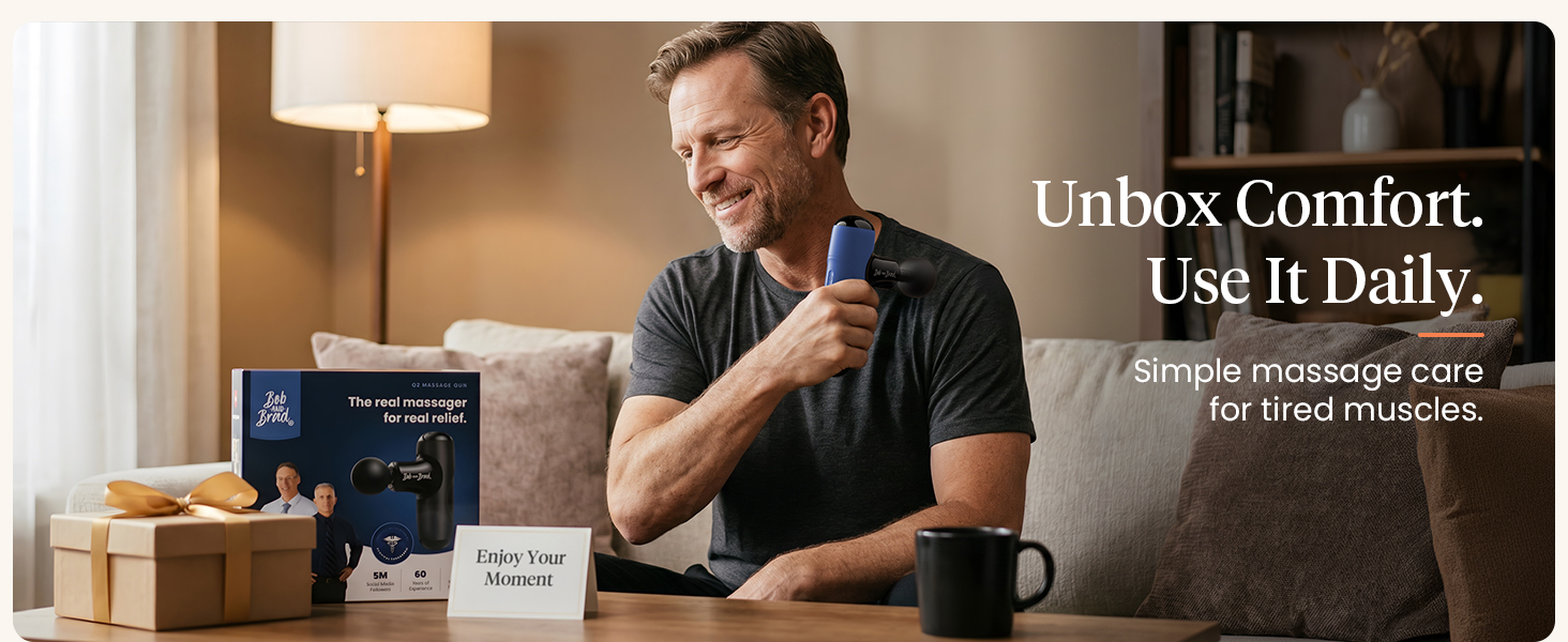 a men using mini massage gun for tired muscles