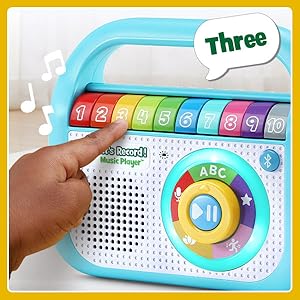 Kid presses the number 3. Player says: 3! Music plays.