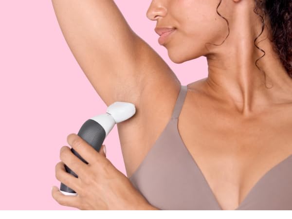 Woman using shaver