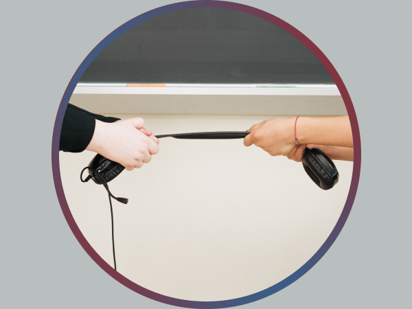 Two children attempting to pull apart a Cyber Acoustics headset