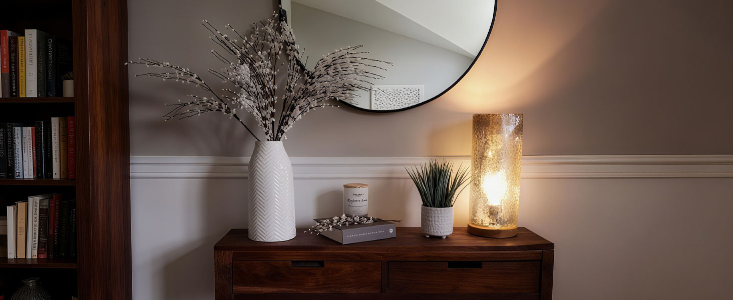 White textured ceramic vase, minimalist design, placed on wooden cabinet