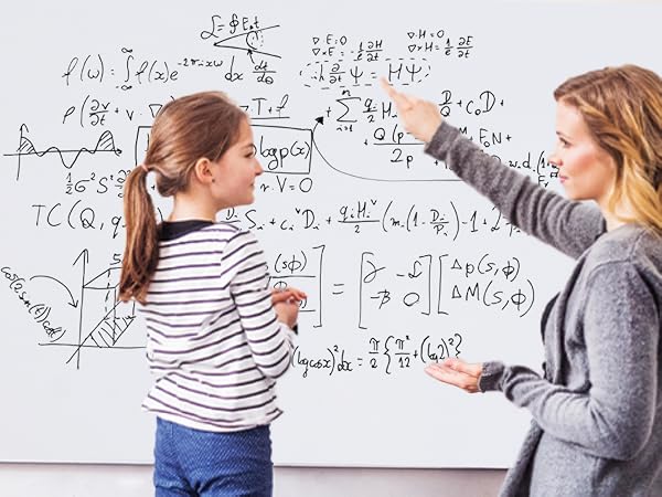 A teacher is pointing to a formula on a whiteboard sticker to explain to a female student