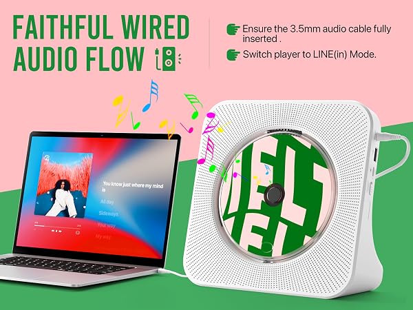 Compact CD player with 3.5mm AUX input connecting to laptop for wired audio playback