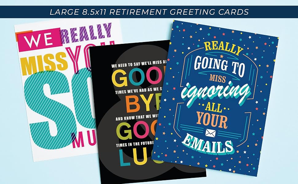 Three huge retirement greeting cards folded on a table.