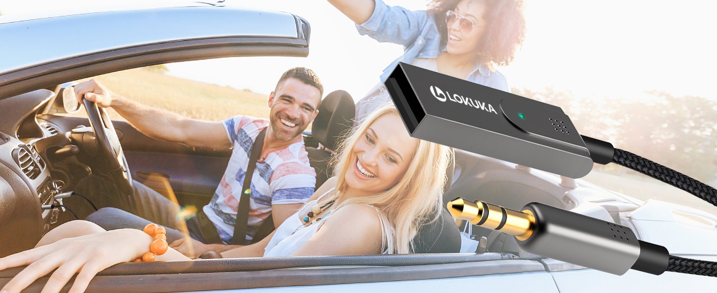 Black USB device with cord, shown in use within a car. Device appears to be a car accessory or adapter.