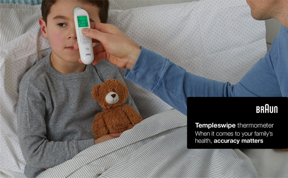 Parent taking kids temperature