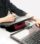 a woman is working on a laptop computer.