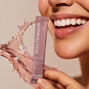 Mouthwash sachet with smiling model and splashing mouthwash liquid in the background.