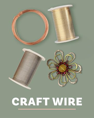 Three spools of craft wire in gold, silver, and copper on a light blue background with