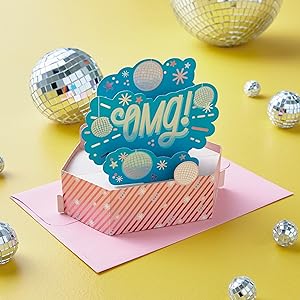 Congratulations pop-up card with "OMG" lettering and disco ball decorations