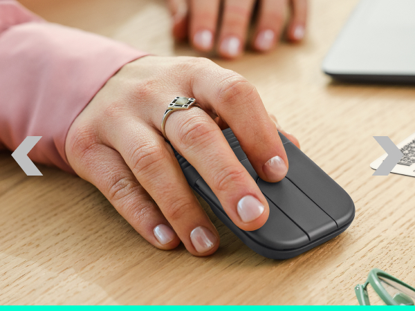 a person holding a foldable mouse