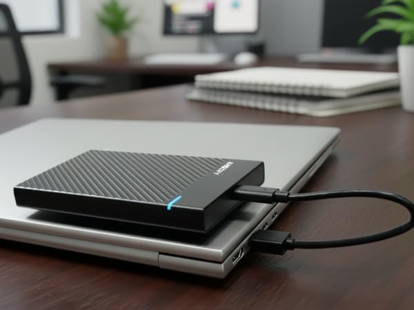 Magnetic external hard drive enclosure attached to laptop, USB-C portable SSD HDD case,