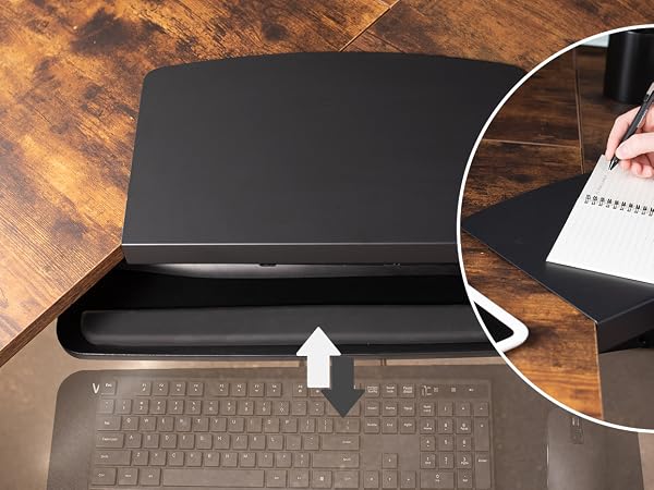 Keyboard tray sliding underneath desk