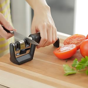 handheld sharpener displayed with tools and knives two manual sharpening slots