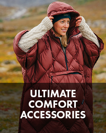 Woman putting the hood up on a poncho