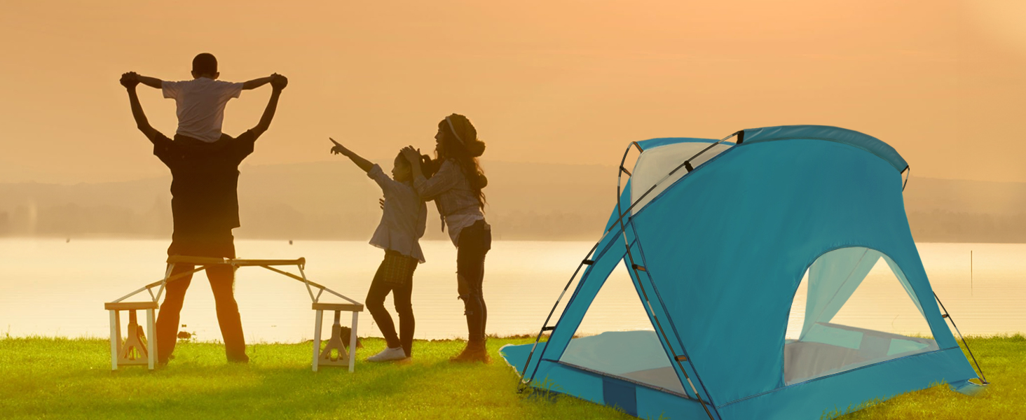 A family of three watching the sunset next to the tent