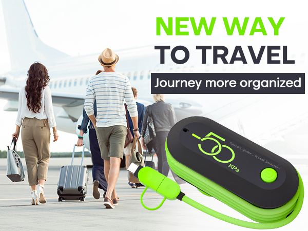 Black and green electronic travel organizer device with attached loop. Background shows travelers with luggage walking towards airplane, text 'NEW WAY TO TRAVEL' visible.