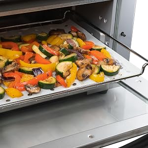 toaster oven with paper liner and food on top