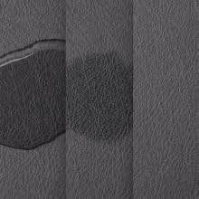 Black PU leather coffee mat absorbing water and hiding stains on its textured surface.