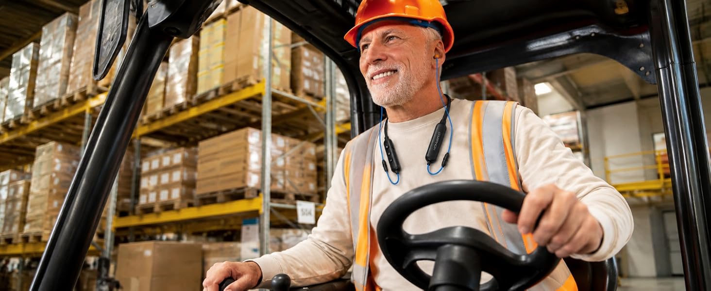 A man wearing the HomeSpot Neckband while drilling at the Warehouse.