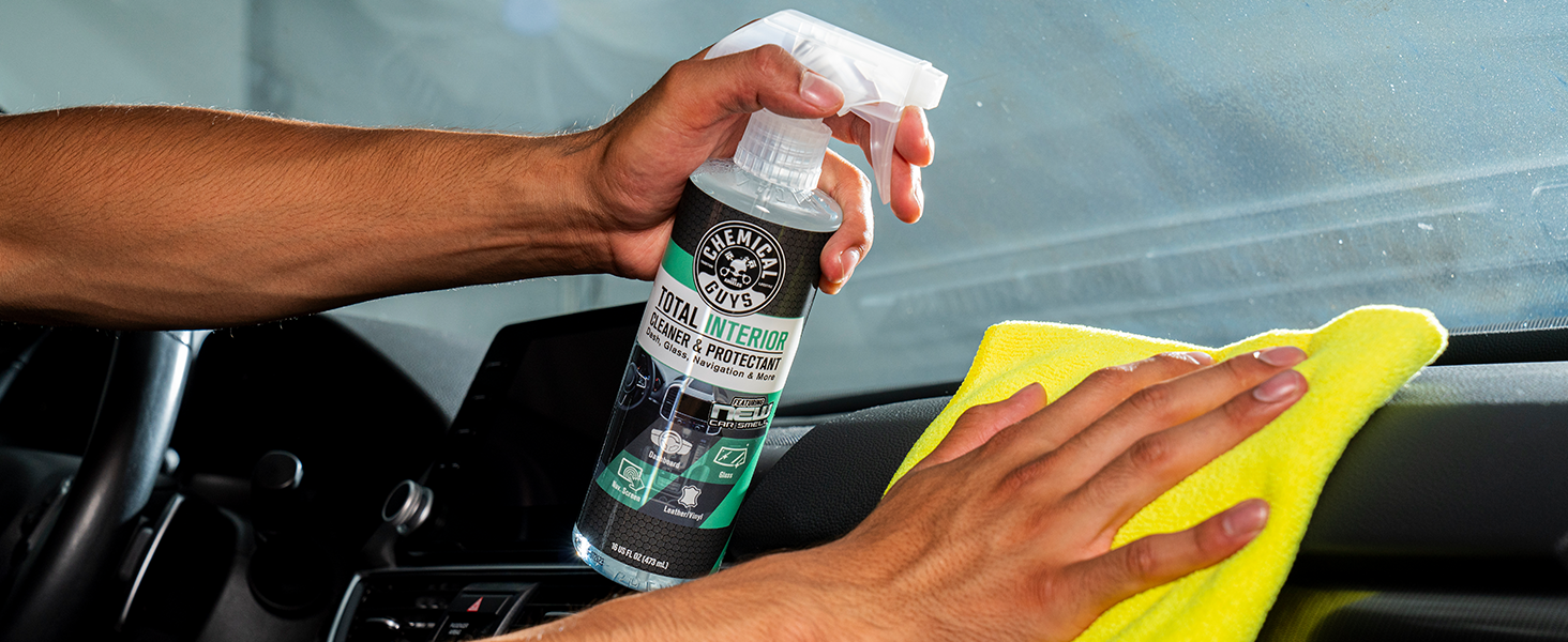 Cleaning car interior controls and buttons with Total Interior Cleaner spray