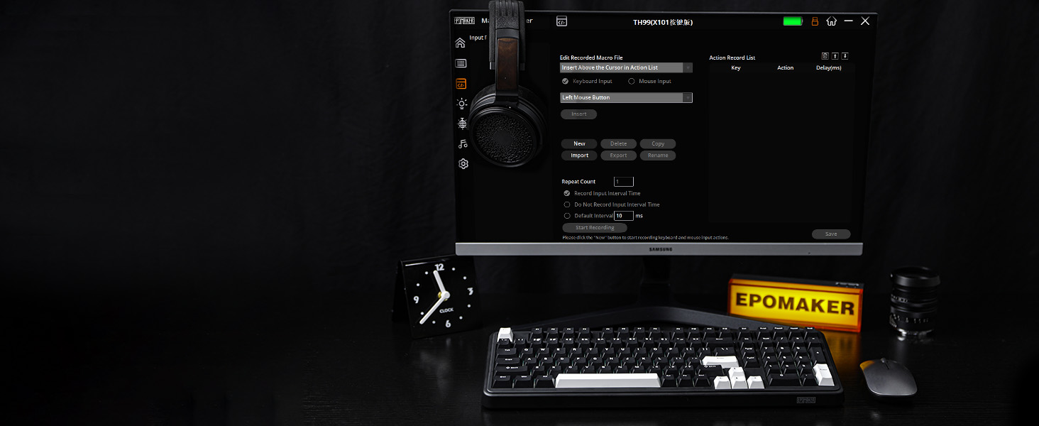 a computer monitor sitting on a desk with headphones on it.