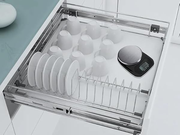 Slide-out kitchen drawer organizer with compartments for plates and a small bowl. Second panel shows hand placing a gray bowl into a fabric storage pouch.