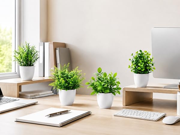 four artificial green plants white pots office desk decor