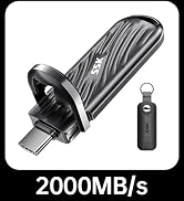 Portable USB-C flash drive with ridged black casing, 2000MB/s speed. Includes small black keychain accessory with matching design.