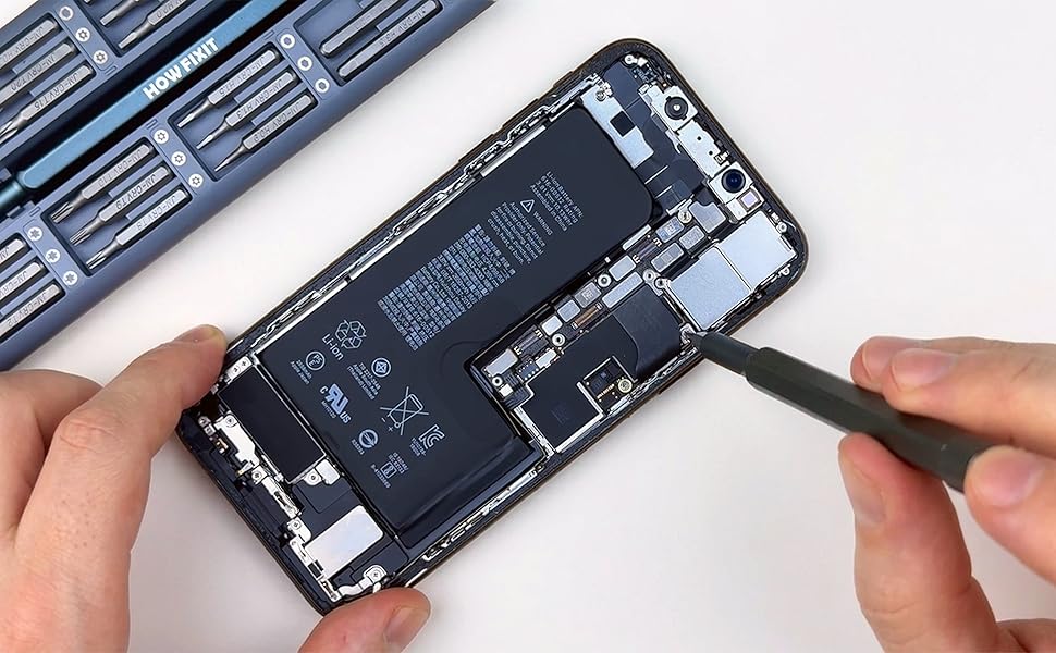Precision screwdriver removing a small screw inside an opened smartphone