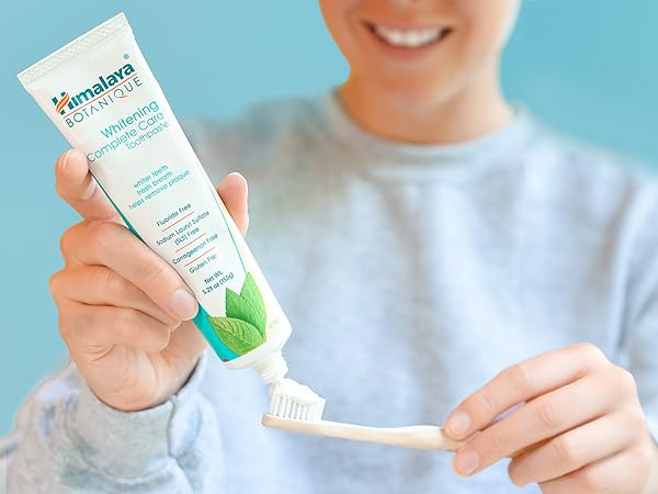 woman and toothpaste
