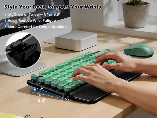 Green Black round-key keyboard and mouse with adjustable tilt legs for a raised typing angle.
