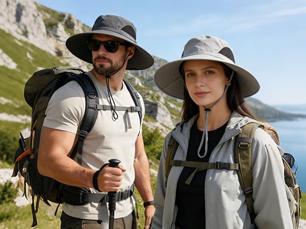 Hiking couple wear sun hats on a mountain. Comfortable hat for trekking & outdoor explorations.