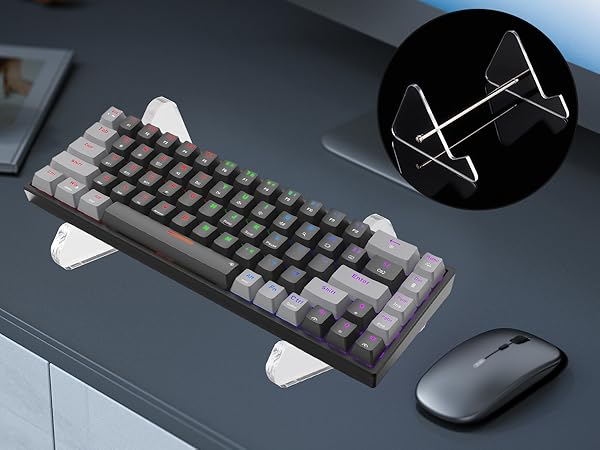 Mechanical keyboard with RGB backlighting and wireless mouse on dark surface, with inset image showing transparent keyboard stand.