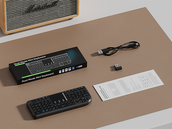 Package Contents: Mini keyboard, instruction manual, charging cable, receiver
