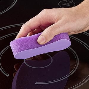 Scotch-Brite glass cooktop cleaning pad cleaning a glass cooktop