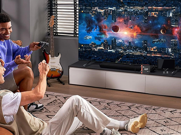Two people play a space-themed Switch game in TV mode, with the 2-in-1 Switch Dock Capture Card