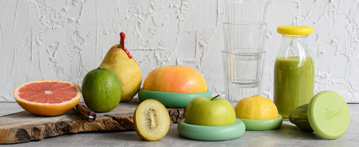 fresh fruits and juice are covered with reusable silicone food savers