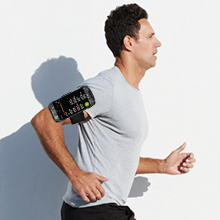 a man wearing a t - shirt with a device on his arm