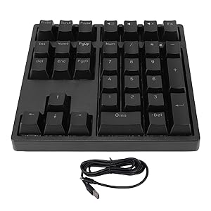 Multiple angles of a compact mechanical keypad with black keycaps, showing its minimal design and USB cable connection.