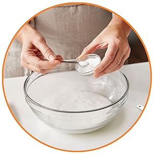 Person adding baking soda