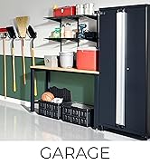 garage with storage cabinet, heavy duty shelves, hooks, totes and workbench table
