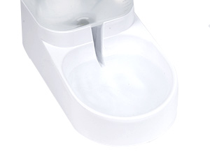 White ceramic bathroom sink with a sleek, modern design. The sink features a smooth, curved basin and an integrated faucet deck. It appears to be a wall-mounted or countertop model.