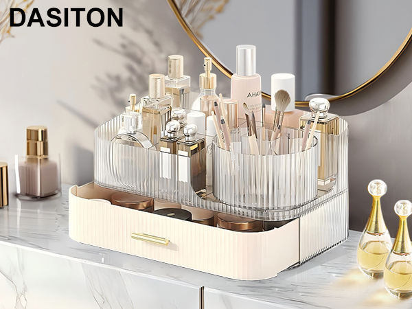 Dasiton cosmetic organizer with clear acrylic compartments and beige drawer. Holds perfume bottles, makeup brushes, and beauty products on a marble countertop near a round mirror.