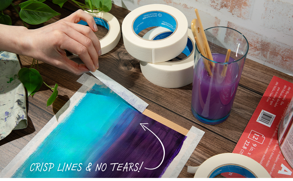 Removing our masking paper tape from a painting to reveal crisp lines and no residue