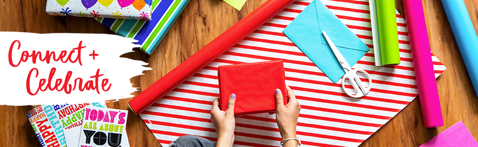 Connect and celebrate; woman sitting on the floor wrapping gifts