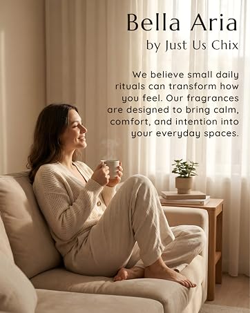 Woman relaxing on couch with coffee in a soft, sunlit room, representing calm, cozy home fragrance