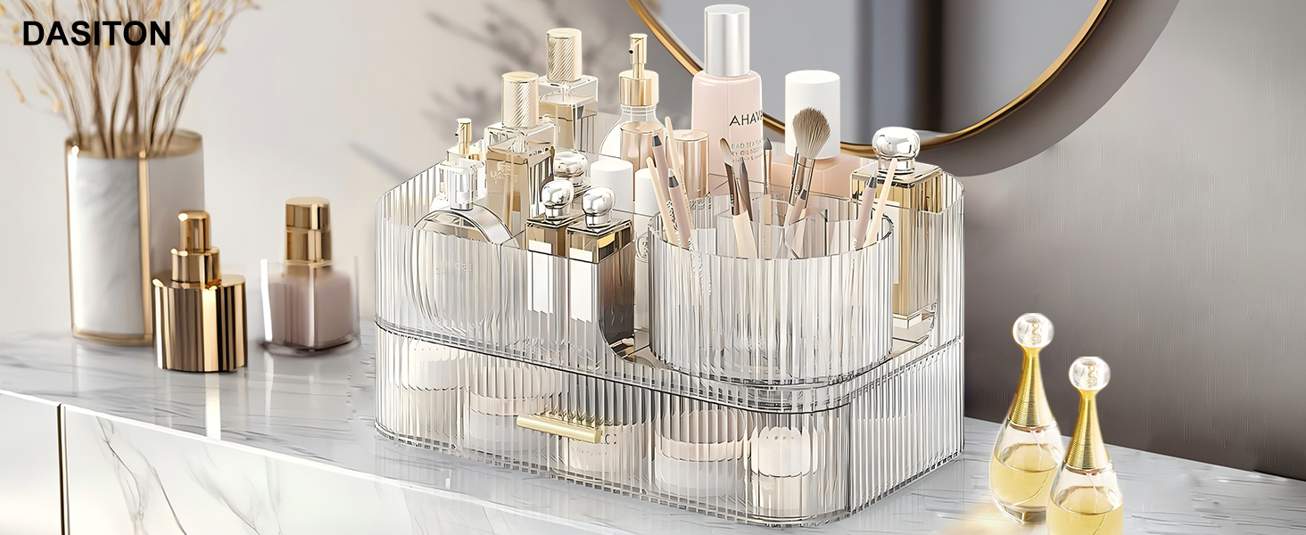 Transparent acrylic makeup organizer with multiple compartments, holding various cosmetic bottles and products. Organizer features ribbed design and curved shape for easy access.