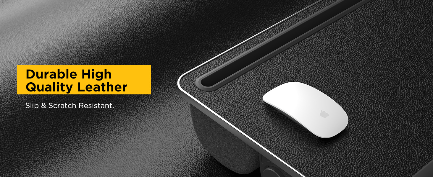 Close-up of textured leather desktop on slip-resistant lap desk with wireless mouse.