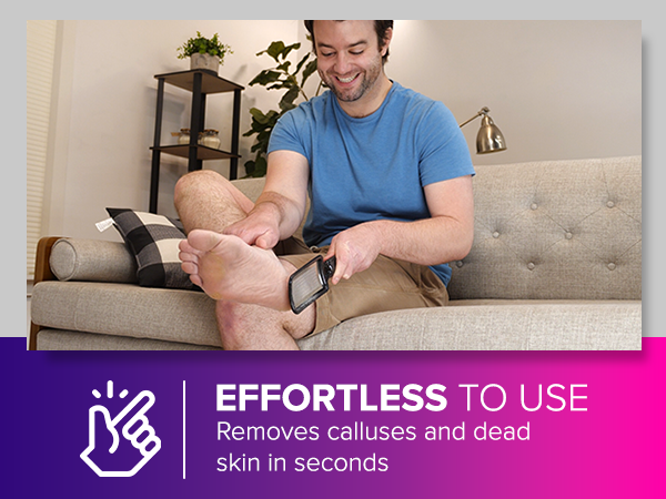 Person using handheld device on bare foot while sitting on couch. Text overlay: 'EFFORTLESS TO USE Removes calluses and dead skin in seconds'